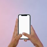 An Individual navigating a mobile-friendly page with SEO optimisation.